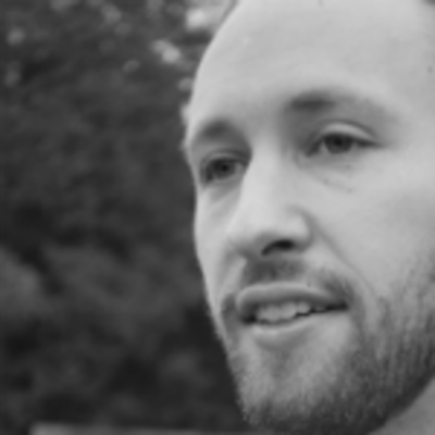 Black and white headshot of Matt Tompkins