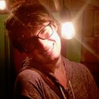 Photo of Robin Cedar with lightbulb behind her