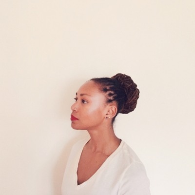 Nicole Cuffy in white shirt against white background