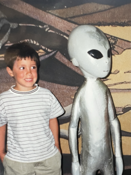 Photo of John Hardberger as a child, with an alien