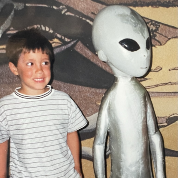 Photo of John Hardberger as a child, with an alien