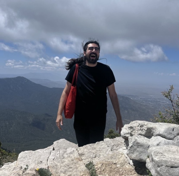 Headshot of Lucas Garcia in the mountains