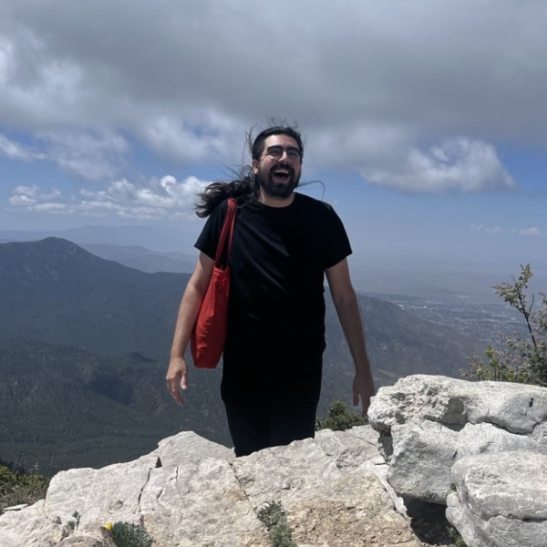 Headshot of Lucas Garcia in the mountains