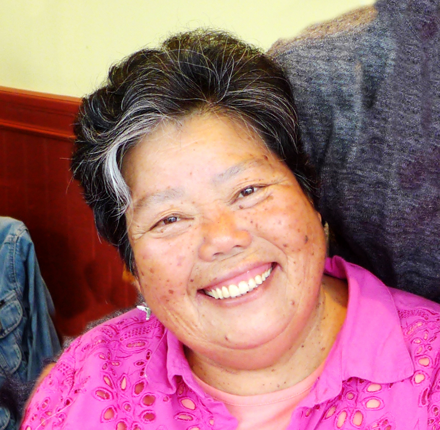 Headshot of Shizue Seigel in a pink shirt.