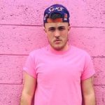 mudd howard in pink shirt against pink background